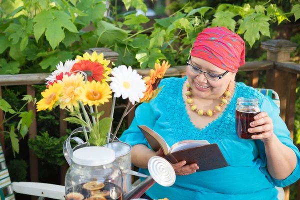 Middle Aged Woman Reads Scripture And Drinks Tea