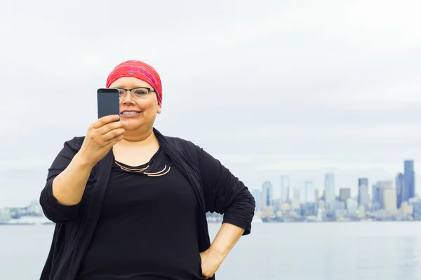 Woman Takes Selfie With Downtown Skyline In Background