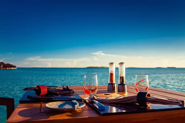 Table setting at tropical beach restaurant