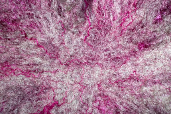 Background from natural merino wool felted closeup
