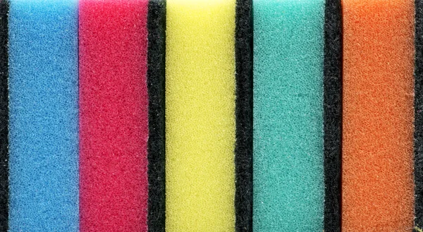 Background of colored kitchen sponges for washing dishes