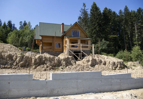 Construction of a wooden cottage in the forest area