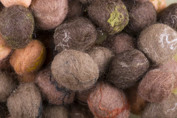 Background of multi-colored balls of wool felted