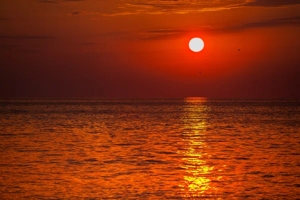 Red sunset over water