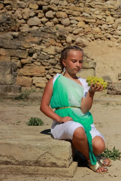 Little girl holding a Greek amphora