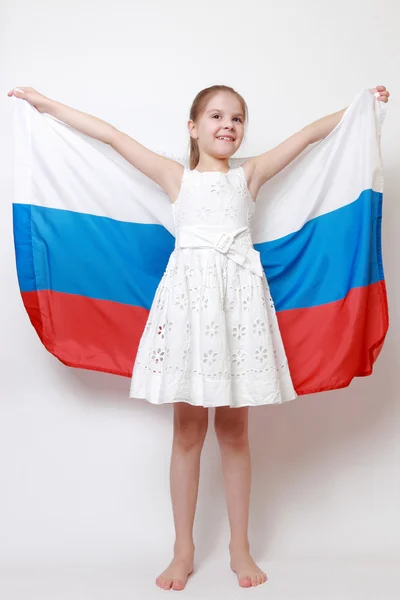 Kid holding symbolic flag