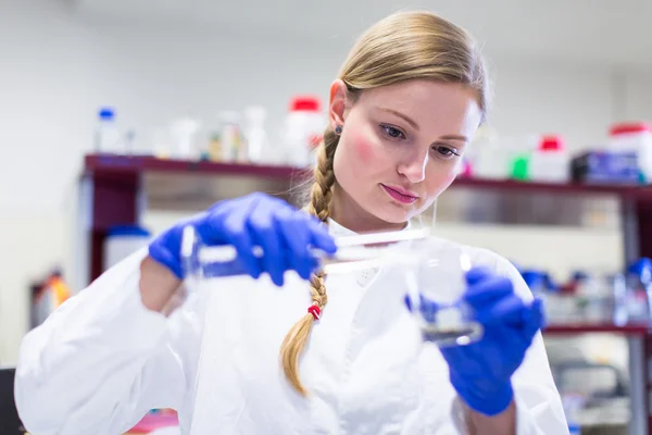 Portrait of a female researcher carrying out research in a lab