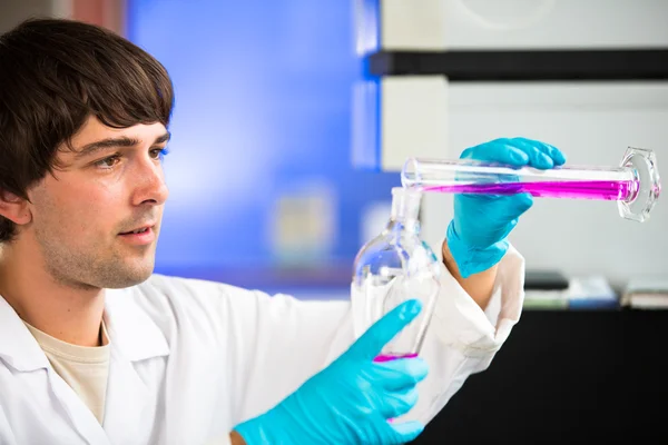 Male researcher carrying out scientific research in a lab