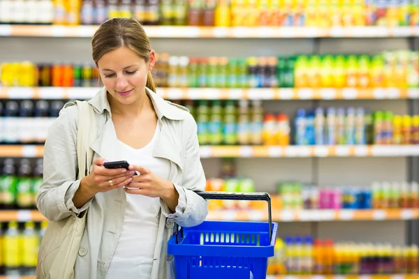 Woman buying groceries in a supermarket