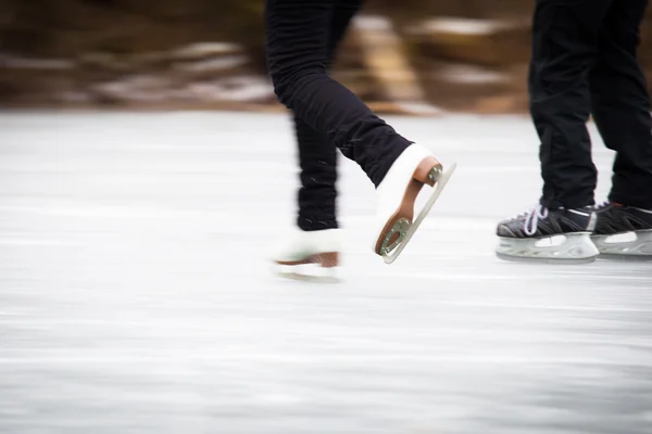 Young woman ice skating outdoors