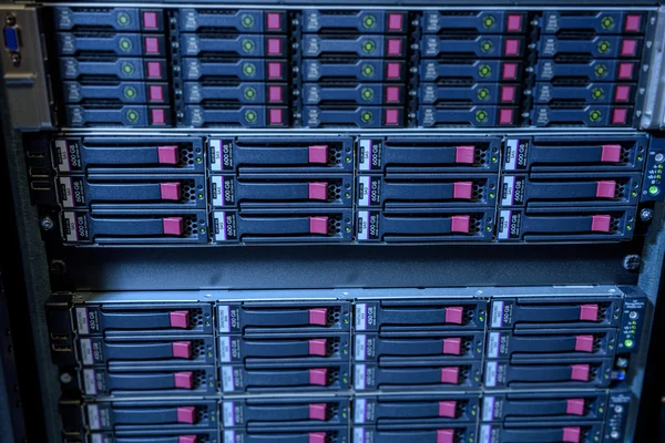 Rack of webserver harddisks in datacenter
