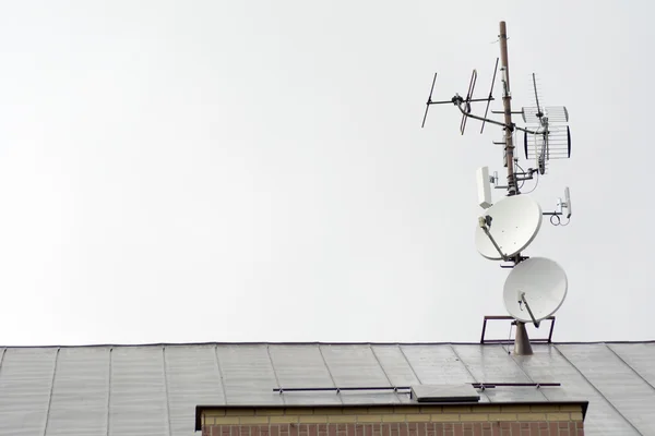 Antennas and satellites on the roof of the house