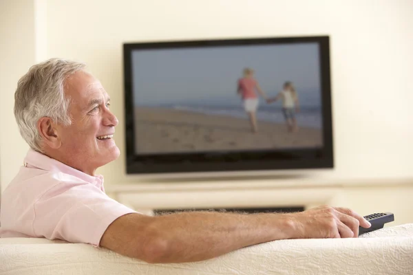 Senior Man Watching Widescreen TV