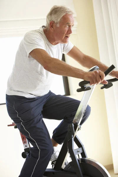 Senior Man On Exercise Bike