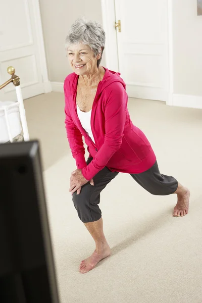 Senior Woman Exercising at Home