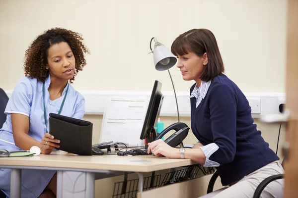 Nurse Showing Patient Test Results