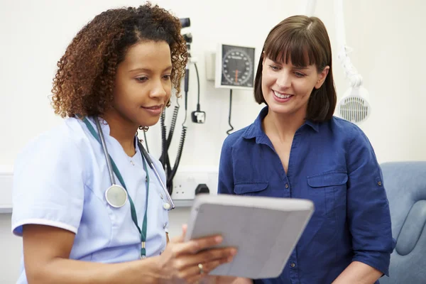 Nurse Showing Patient Test Results