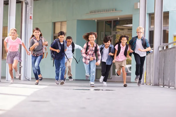 Kids running in a school corridor