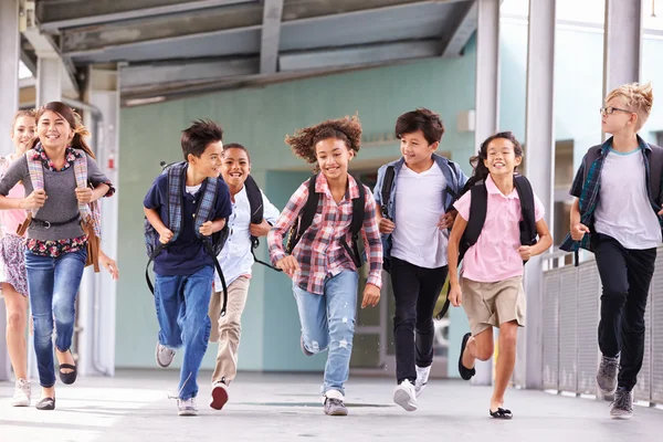 Kids running in a school corridor