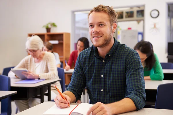 Man at adult education class