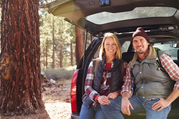 Couple by their car before hiking