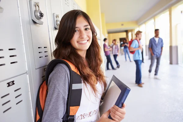 Female Student Standing By Lockers