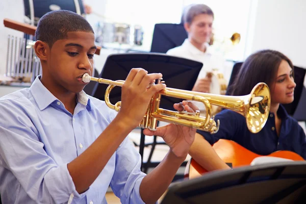 Male Pupil Playing Trumpet