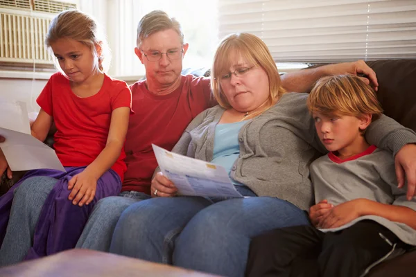 Unhappy Family  Looking At Bills