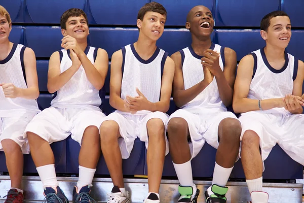 Members Of Basketball Team Watching Match