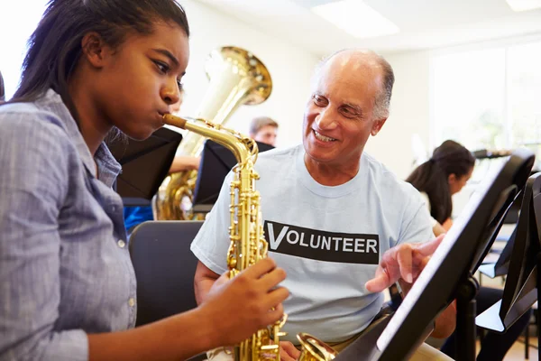 Girl Learning To Play Saxophone