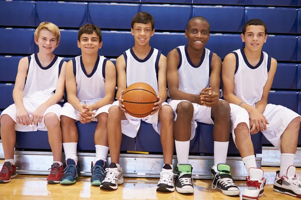 Members Of School Basketball Team On Bench