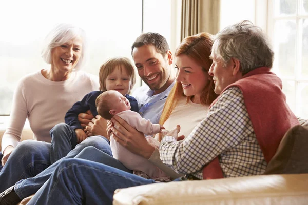 Multi Generation Family Sitting With Newborn