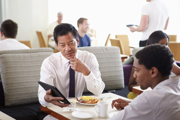 Businessmen Meeting Over Breakfast