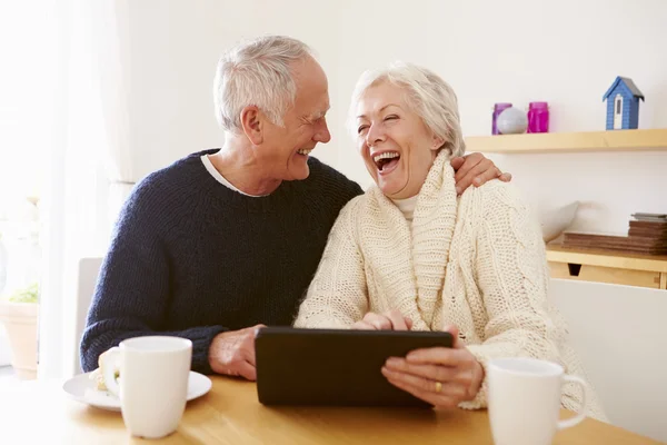 Senior Couple Using Digital Tablet