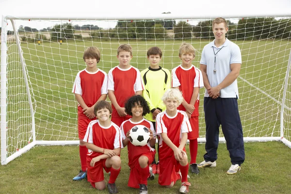 Junior football team and coach portrait