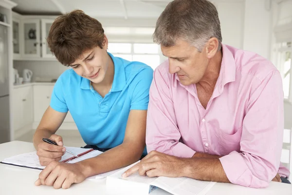 Father helping son with homework