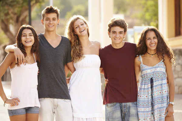 Teenage Group Walking Along Street