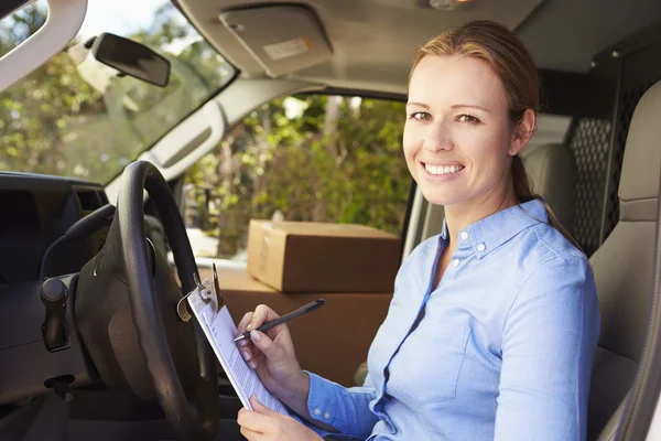 Female Delivery Driver In Van