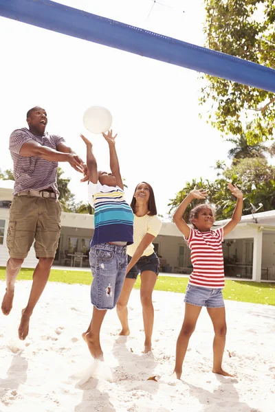 Family Playing Game Of Volleyball