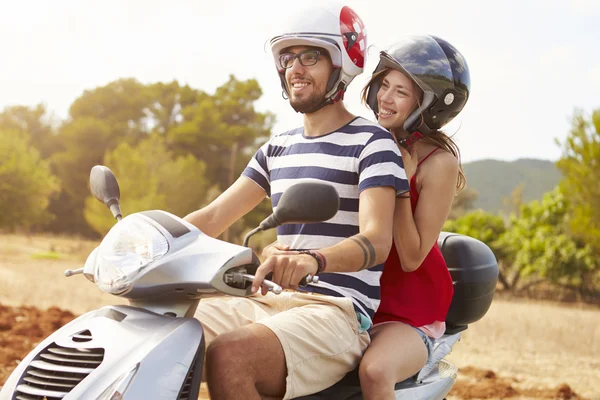 Couple Riding Motor Scooter