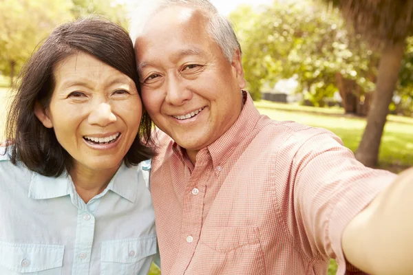 Senior Asian Couple Taking Selfie
