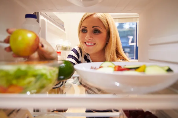 Woman Looking Inside Fridge