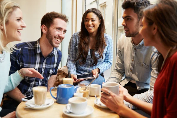 Group Of Friends Using Digital Devices