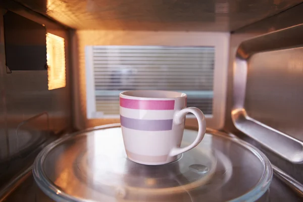 Cup Of Coffee Inside Microwave Oven