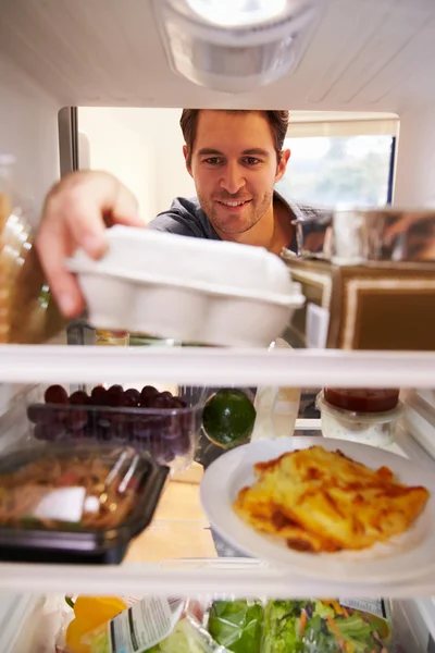 Man Looking Inside Fridge