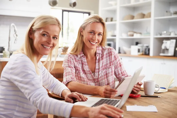 Two women working together