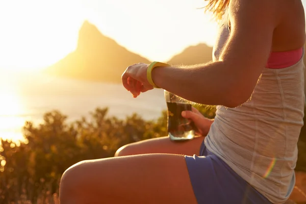 Woman checking her sports watch