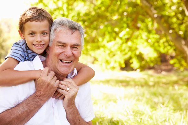 Grandfather having fun with his grandson