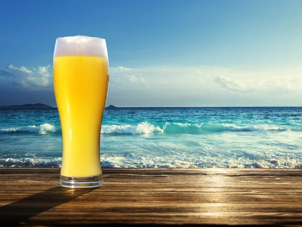 Fresh  unfiltered beer and tropical beach