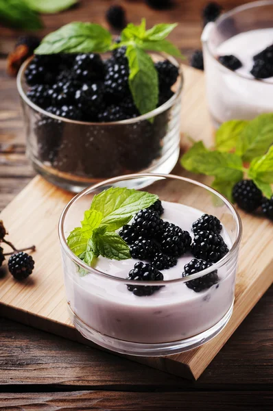 Dessert with blackberries in bowls
